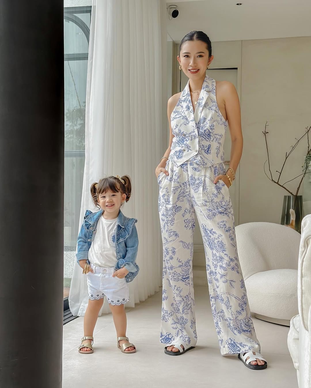 Camille and Sienna wearing white and blue outfits for the summer