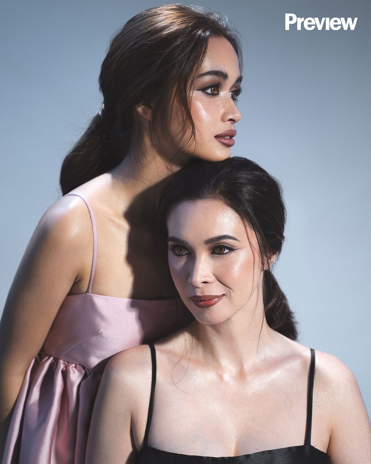Sunshine and Angelina Cruz are twinning in Vania Romoff dresses.