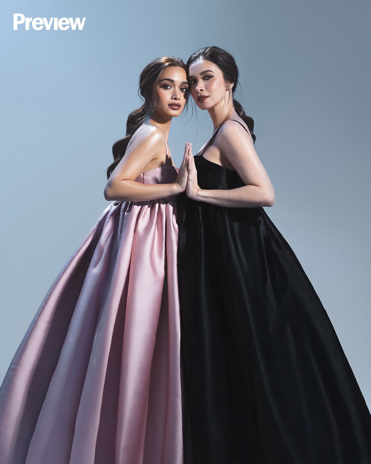 Sunshine and Angelina Cruz are twinning in Vania Romoff dresses.