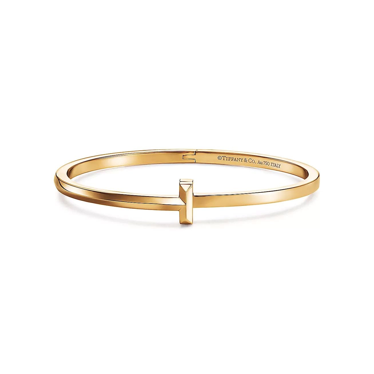 T1 Narrow Hinged Bangle in Yellow Gold, $5,200 (approximately P290,084.60), TIFFANY & CO., tiffany.com