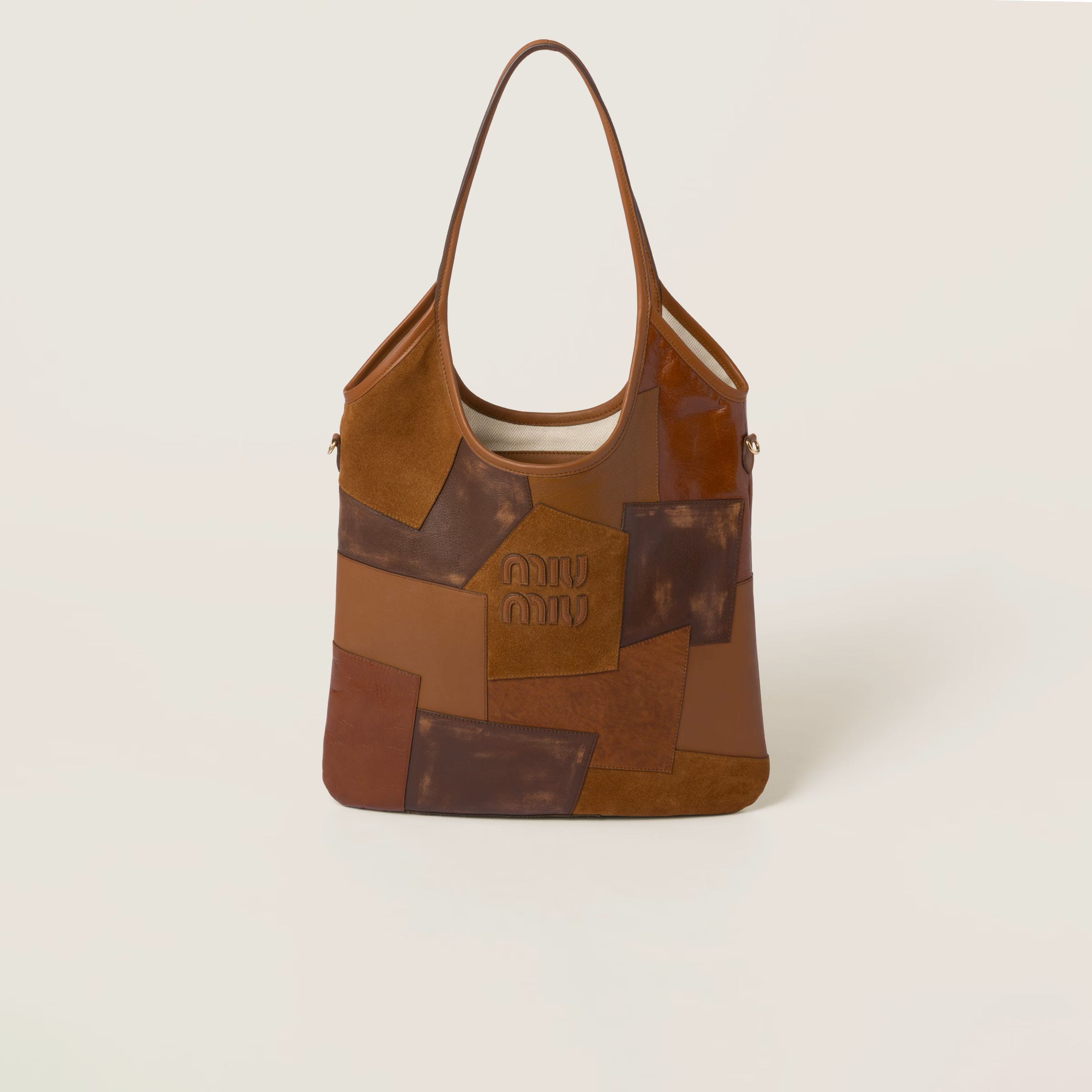 Cognac IVY leather patchwork bag, € 2450 (approximately P156,084.60), MIU MIU, miumiu.com