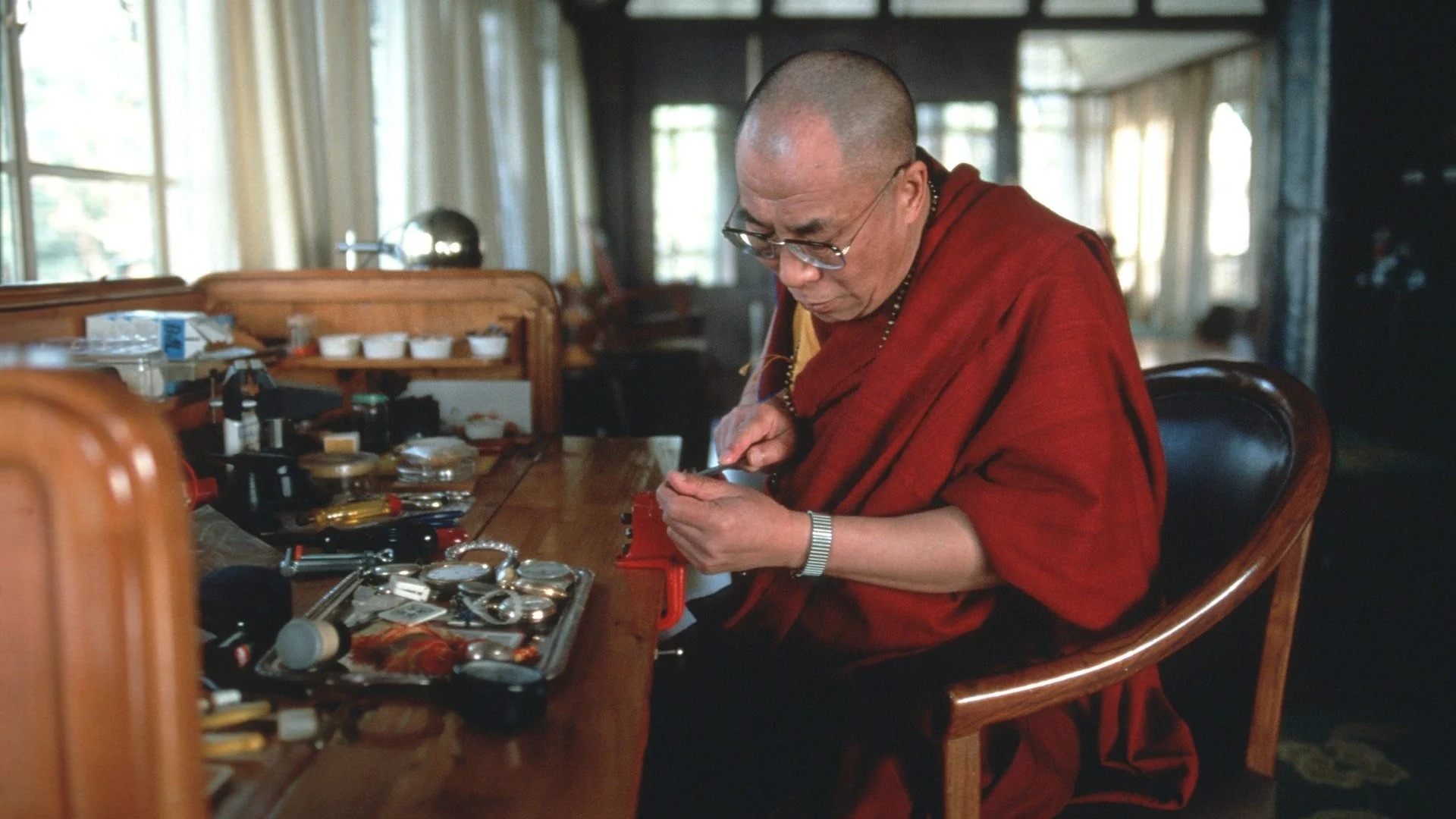 Dalai Lama repairing watches