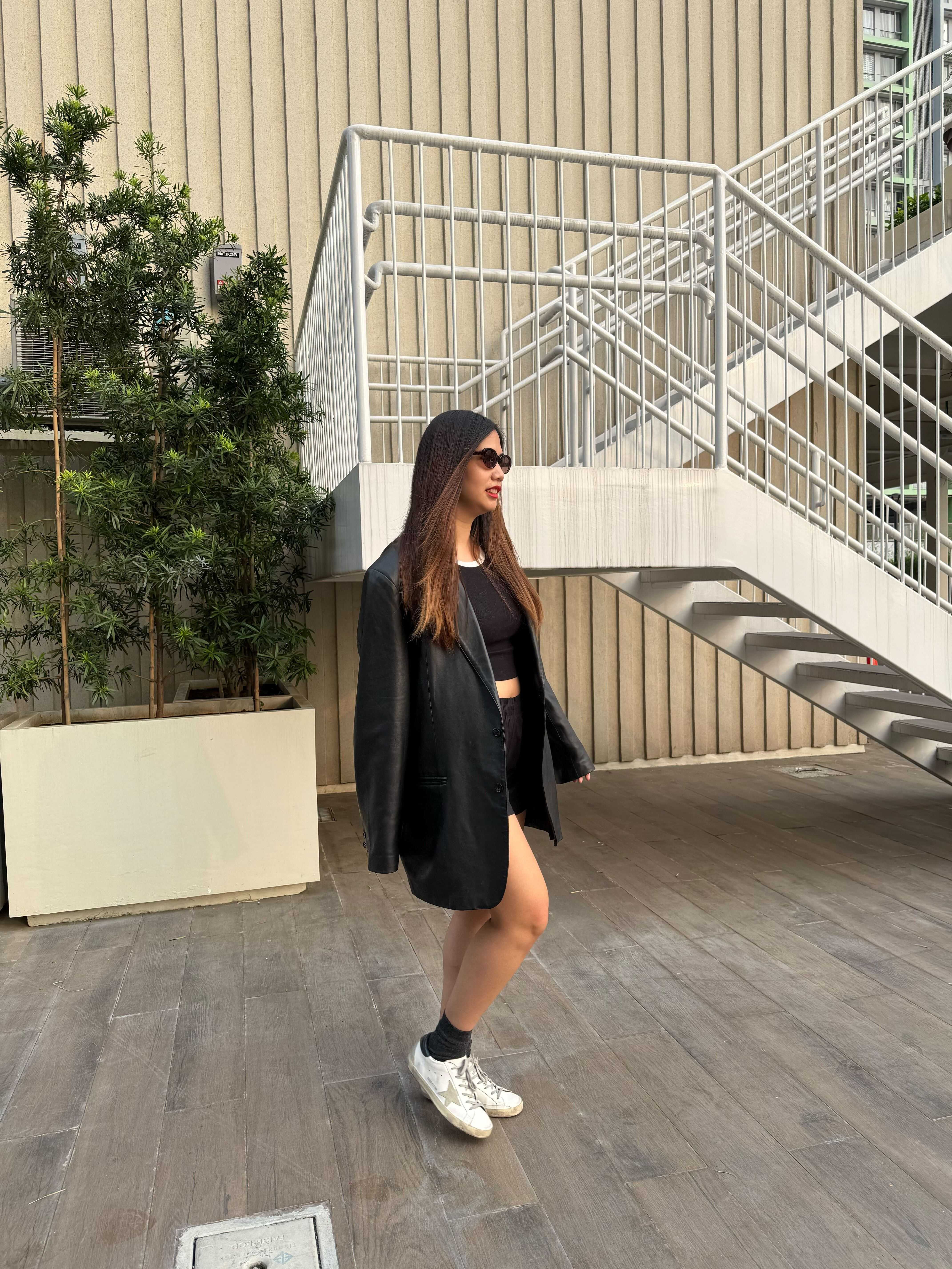 Reg Rodriguez wearing her Golden Goose Super-Stars