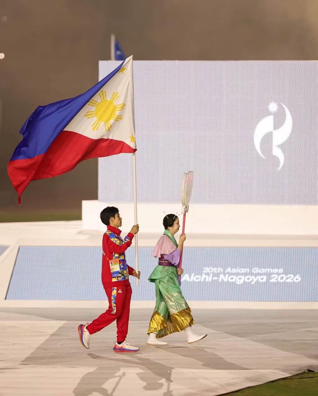Jeus Yape flagbearer at the 2026 Asian Games closing ceremony