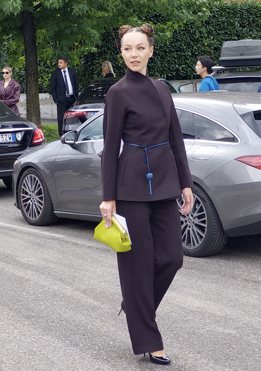 Woman in black attending Paris Fashion Week