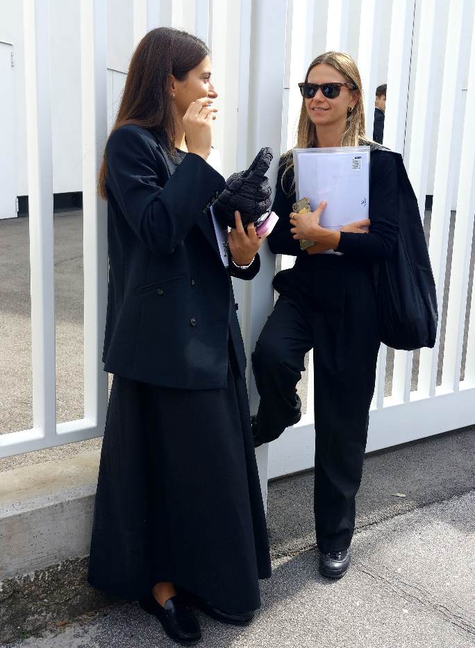 Two women chatting at Paris Fashion Week