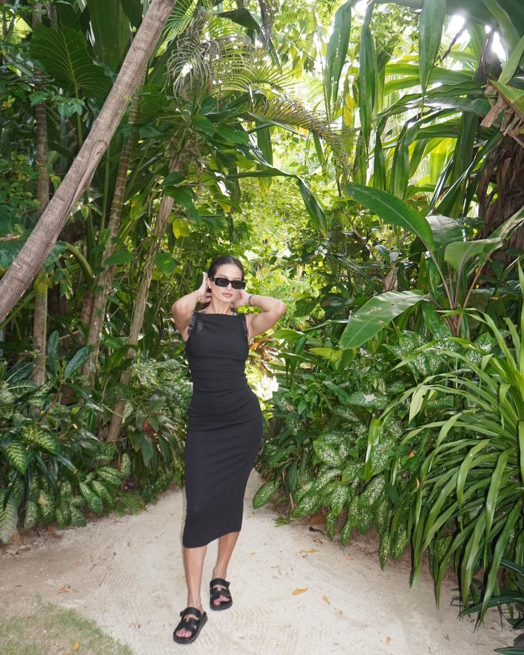 Sarah Lahbati wearing Hermes Chypre sandals